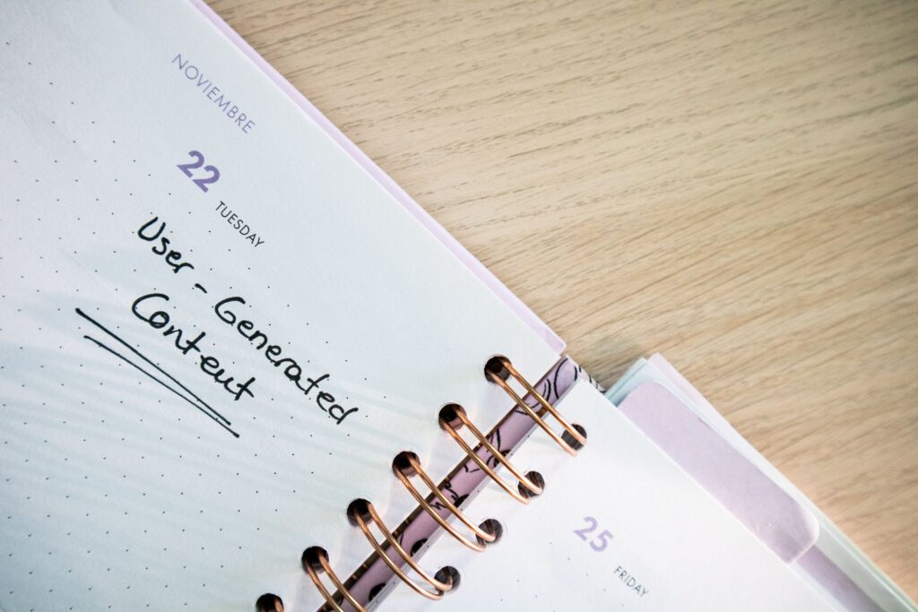 Planner open on a desk with dates and handwritten notes